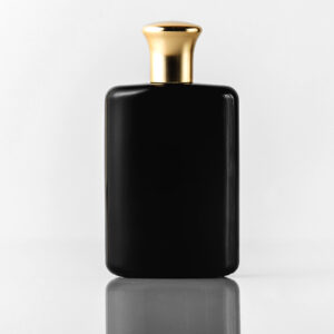 front view black fragrance designed with gold cap white floor