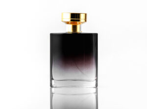 front view black fragrance with golden cap white isolated desk