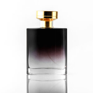 front view black fragrance with golden cap white isolated desk